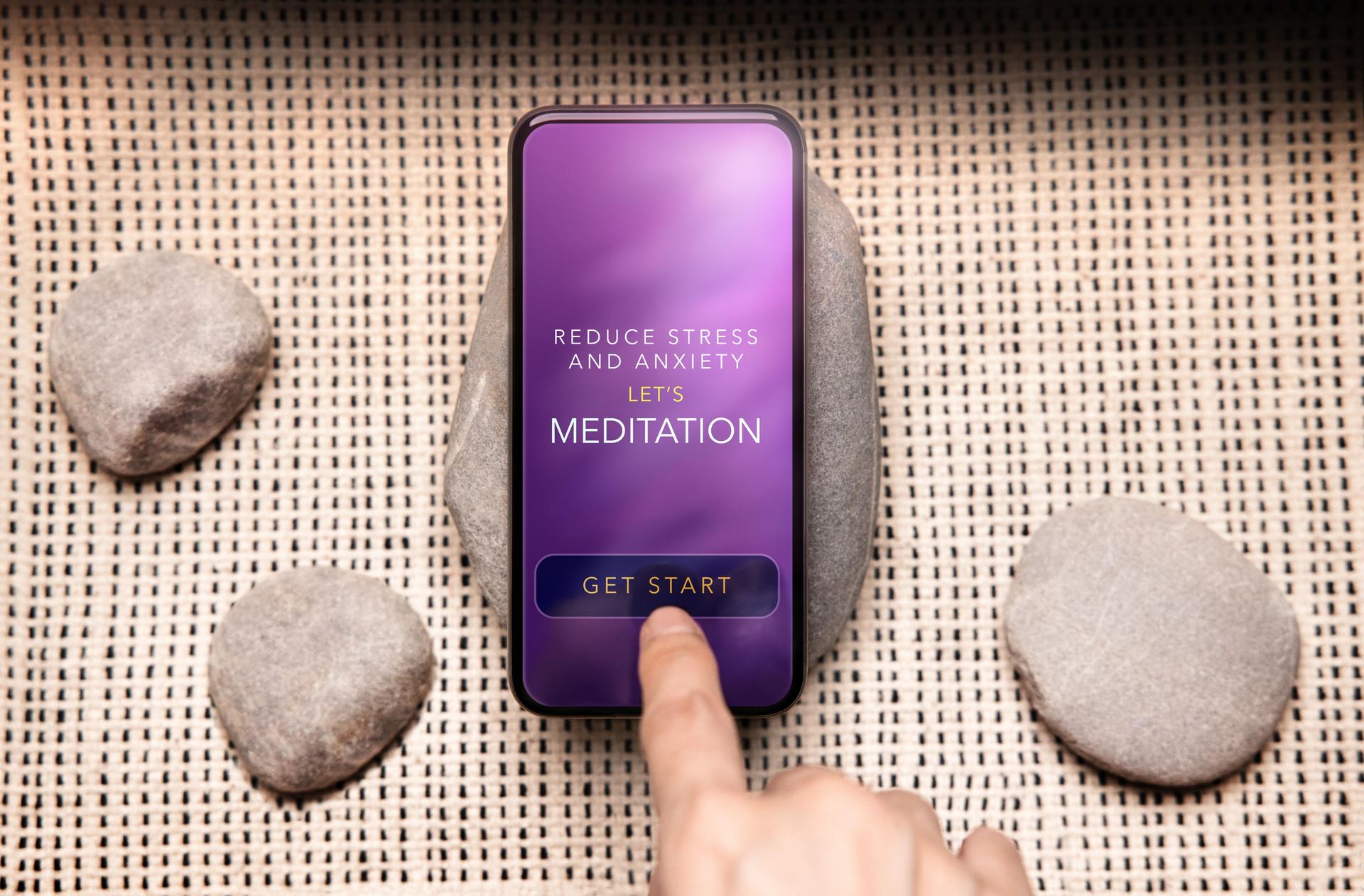 Mental Health Concept. Person Using Tech to Healing and Practicing Mind. Self Care and Soothing Life. Meditation App show on Mobile Phone. Scene as Zen. Top View